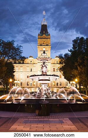 Stock Image - Tourny Fountain And Parliament Building At Dusk, Quebec City, Quebec. Fotosearch
