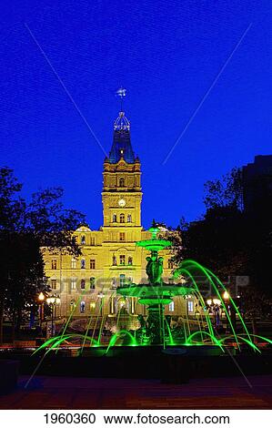 Stock Image - Tourny Fountain And The Quebec Parliament Buildings At Night; Quebec City, Quebec, Canada. Fotosearch