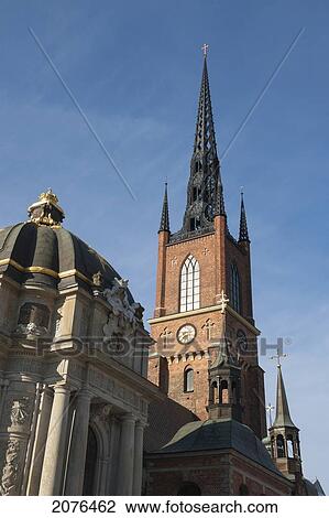 Tower Of A Church Building Against A Blue Sky In Old Town; Stockholm Sweden View Large Photo Image Stock Image - Tower Of A Church Building Against A Blue Sky In Old Town; Stockholm Sweden. Fotosearch