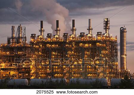 Towers Of A Refinery Illuminated By Lights At Dawn; Alberta Canada View Large Photo Image Stock Photography - Towers Of A Refinery Illuminated By Lights At Dawn; Alberta Canada. Fotosearch