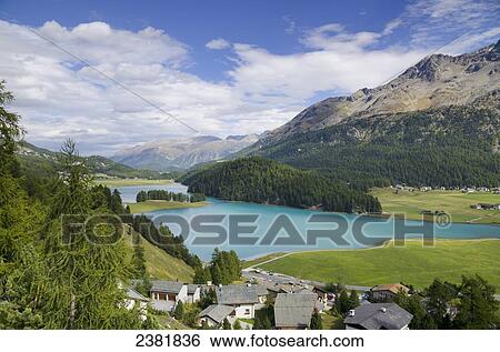 Stock Photograph - Town by an alpine lake and mountains; St Moritz, Grisons, Switzerland. Fotosearch