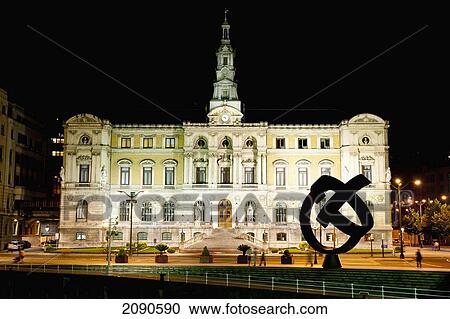 Stock Image - Town Hall At Night And Jorge Oteiza Sculpture, Bilbao, Basque Country, Spain. Fotosearch