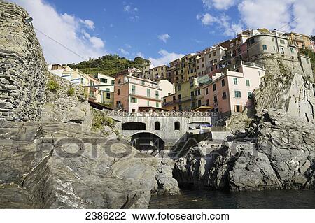 Stock Image - Town of Manarola and coastline, Cinque Terre; La Spezia, Liguria, Italy. Fotosearch