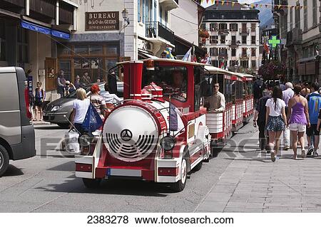 Toy train transporting people in the centre of Chamonix-Mont Blanc; Chamonix, Mont Blanc Valley, France View Large Photo Image Stock Photo - Toy train transporting people in the centre of Chamonix-Mont Blanc; Chamonix, Mont Blanc Valley, France. Fotosearch