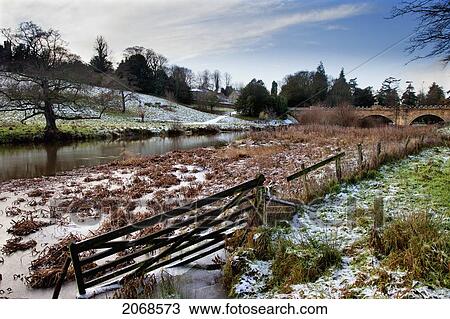 Traces Of Snow Along The River; Alnwick Northumberland England View Large Photo Image Stock Image - Traces Of Snow Along The River; Alnwick Northumberland England. Fotosearch