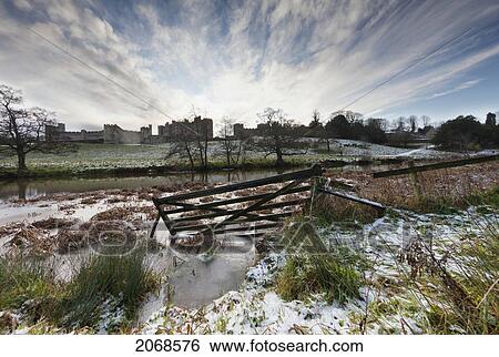 Traces Of Snow Along The River With Alnwick Castle In The Distance; Alnwick Northumberland England View Large Photo Image Stock Photograph - Traces Of Snow Along The River With Alnwick Castle In The Distance; Alnwick Northumberland England. Fotosearch