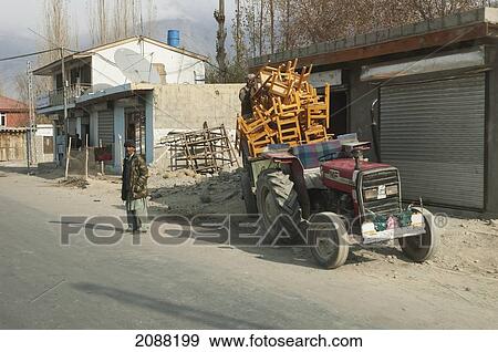 Tractor And Trailer Laden With Chairs, Skardu, Northern Areas, Pakistan View Large Photo Image Stock Photo - Tractor And Trailer Laden With Chairs, Skardu, Northern Areas, Pakistan. Fotosearch