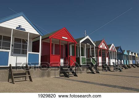 Stock Image - Traditional beach huts on the seafront at Southwold, Suffolk, UK. Fotosearch