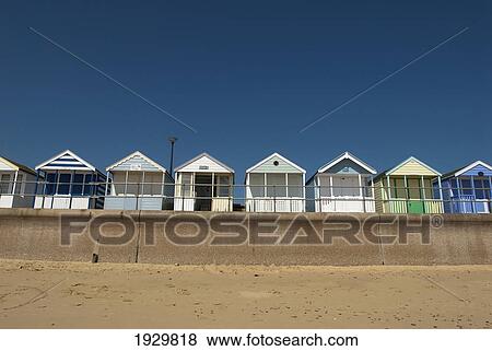 Stock Photo - Traditional beach huts on the seafront at Southwold, Suffolk, UK. Fotosearch