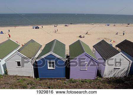 Stock Photograph - Traditional beach huts on the seafront at Southwold, Suffolk, UK. Fotosearch