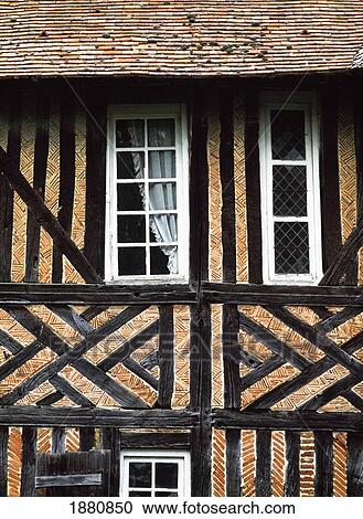 Stock Image - Traditional Brick And Timber House, Close Up. Fotosearch