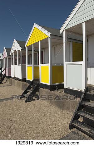 Traditional colourful beach huts on the seafront; Southwold, Suffolk, England View Large Photo Image Stock Photo - Traditional colourful beach huts on the seafront; Southwold, Suffolk, England. Fotosearch