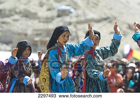 Stock Image - Traditional dancers in the opening parade of the Ladakh Festival. The Ladakh Festival is held every year in the first two weeks of September and celebrates local culture through dance and sport. Ladakh, Province of Jammu and Kashmir, India. Fotosearch