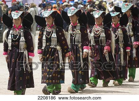 Stock Photograph - Traditional dancers in the opening parade of the Ladakh Festival. The Ladakh Festival is held every year in the first two weeks of September and celebrates local culture through dance and sport. Ladakh, Province of Jammu and Kashmir, India. Fotosearch