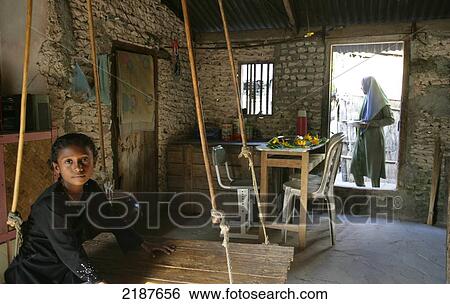 Stock Photograph - Traditional home life in a village on an island; Maldives. Fotosearch