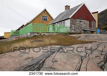 Stock Image - Traditional Houses In A Village On The East Coast Of Greenland; Kangaamiut, Greenland. Fotosearch