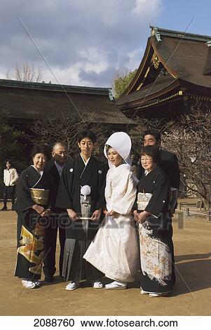 Stock Image - Traditional Japanese Wedding In Front Of Zen Temple; Kyoto, Japan. Fotosearch