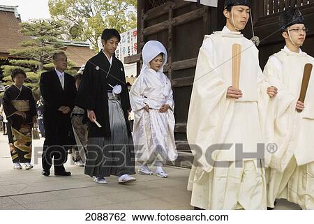 Traditional Japanese Wedding Walking Through The Temple Gate; Kyoto, Japan View Large Photo Image Stock Image - Traditional Japanese Wedding Walking Through The Temple Gate; Kyoto, Japan. Fotosearch