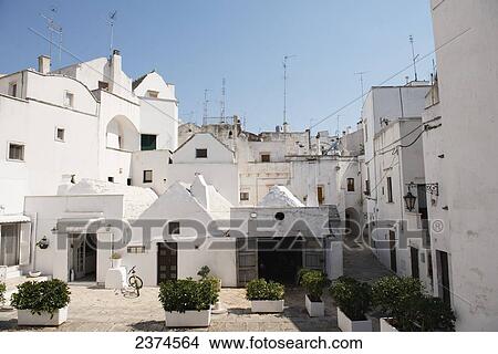 Traditional Puglian architecture with antennas on the rooftops; Martina Franca, Puglia, Italy View Large Photo Image Picture - Traditional Puglian architecture with antennas on the rooftops; Martina Franca, Puglia, Italy. Fotosearch