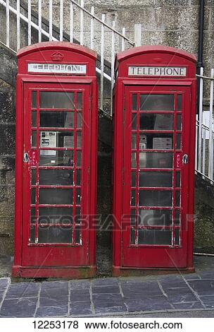 Stock Photo - Traditional red English telephone boxes; Cornwall, England. Fotosearch