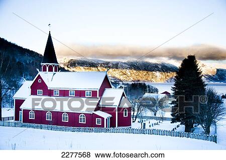 Traditional red Norwegian church, in the village in winter with snow; Ortnevik, Sognefjord, Norway View Large Photo Image Stock Photo - Traditional red Norwegian church, in the village in winter with snow; Ortnevik, Sognefjord, Norway. Fotosearch