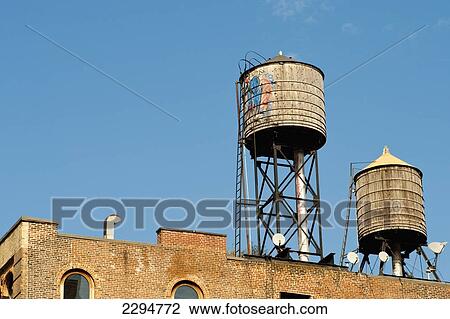 Stock Image - Traditional Water Deposits In A Roof In Manhattan, New York, Usa. Fotosearch