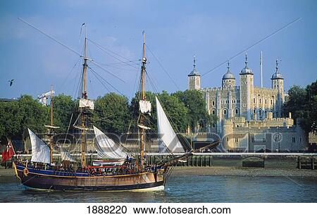 Stock Image - Traditional Wooden Sailing Ship Passing Tower Of London. Fotosearch