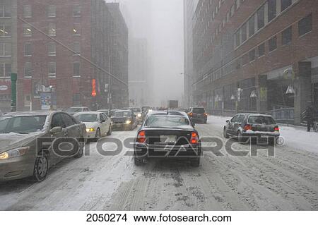 Traffic In A Snow Storm, Front Street, Toronto, Ontario View Large Photo Image Picture - Traffic In A Snow Storm, Front Street, Toronto, Ontario. Fotosearch