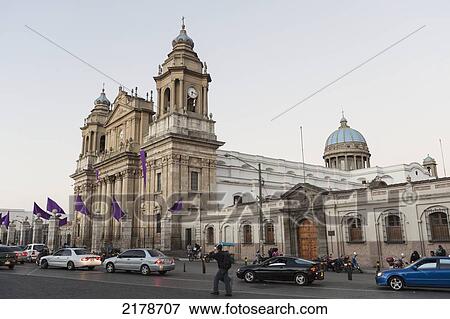 Stock Photo - Traffic Lined Up On The Street Outside The Cathedral Of Guatemala City; Guatemala City Guatemala. Fotosearch