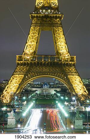 Stock Image - Traffic On Champs D'elysees Under Eiffel Tower At Night, Paris, France. Fotosearch