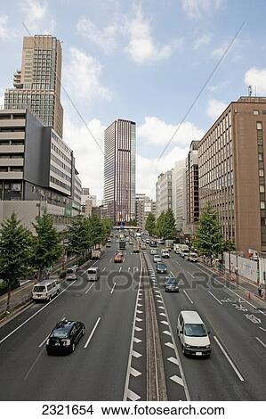 Traffic on road in busy urban area; Tokyo, Japan View Large Photo Image Picture - Traffic on road in busy urban area; Tokyo, Japan. Fotosearch