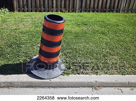 Stock Photo - Traffic pylon next to road; toronto ontario canada. Fotosearch