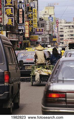 Stock Image - Traffic stopped on a road in a busy city; Taipei, China. Fotosearch