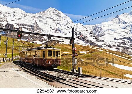 Stock Photo - Train from Kleine Scheidegg to Jungfraujoch; Bernese Oberland, Switzerland. Fotosearch