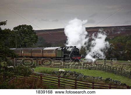 Stock Photo - Train In Motion; Grosmont, North Yorkshire, England, Uk. Fotosearch