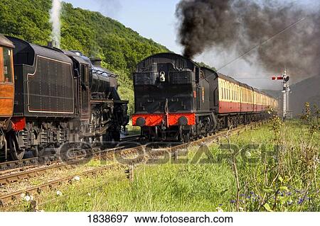 Stock Photo - Train In Motion; Levisham, North Yorkshire, England, Uk. Fotosearch