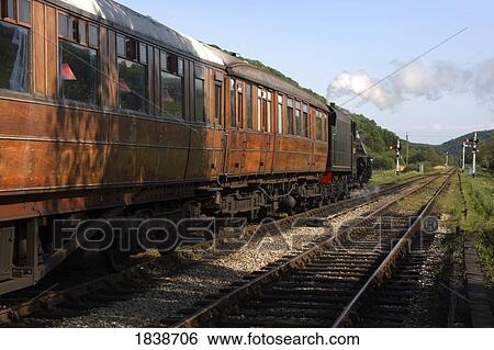 Stock Photograph - Train In Motion; Levisham, North Yorkshire, England, Uk. Fotosearch