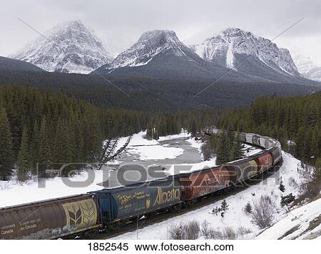 Stock Photography - Train Moving Through Banff, Alberta, Canada. Fotosearch