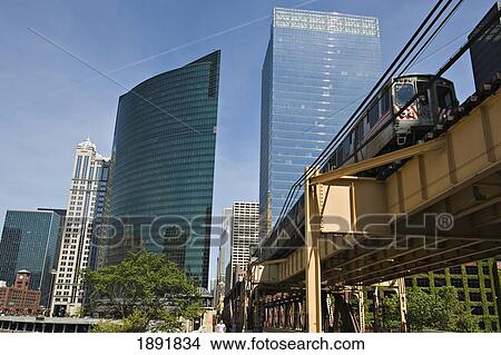Train On Elevated Train Trucks With Skyscrapers In Background View Large Photo Image Picture - Train On Elevated Train Trucks With Skyscrapers In Background. Fotosearch
