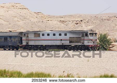 Train Travelling Along The Nile River Between Aswan And Edfu, Aswan, Egypt View Large Photo Image Stock Photograph - Train Travelling Along The Nile River Between Aswan And Edfu, Aswan, Egypt. Fotosearch
