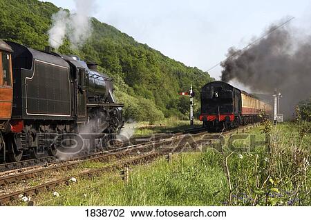 Trains In Motion; Levisham, North Yorkshire, England, Uk View Large Photo Image Stock Image - Trains In Motion; Levisham, North Yorkshire, England, Uk. Fotosearch
