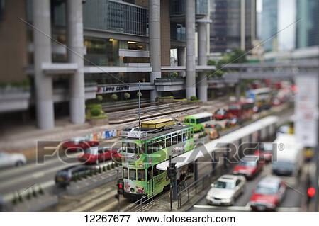 Tram and traffic on busy street; Hong Kong View Large Photo Image Stock Photo - Tram and traffic on busy street; Hong Kong. Fotosearch