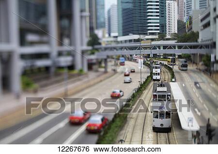 Tram running on track beside road; Hong Kong View Large Photo Image Stock Photograph - Tram running on track beside road; Hong Kong. Fotosearch