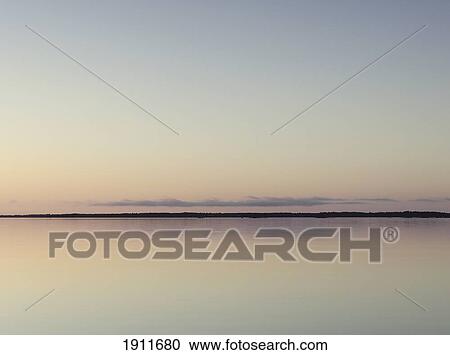 Tranquil Lake Vanern At Dusk, Mariestad, Sweden View Large Photo Image Stock Image - Tranquil Lake Vanern At Dusk, Mariestad, Sweden. Fotosearch