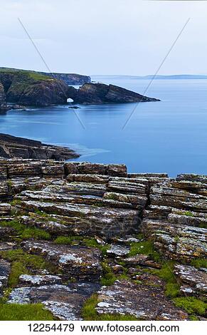 Tranquil water along the coastline of Orkney Islands; Orkney, Scotland View Large Photo Image Stock Photo - Tranquil water along the coastline of Orkney Islands; Orkney, Scotland. Fotosearch