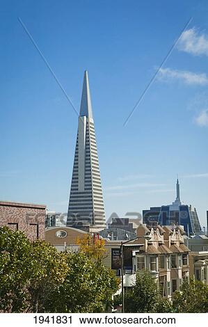 Stock Image - Transamerica Pyramid Skyscraper And Row Houses; San Francisco California United States Of America. Fotosearch