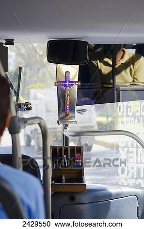 Stock Image - Transit bus in Mexico with Christian crucifix in the front window; Guanajuato, Mexico. Fotosearch