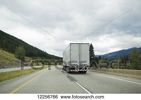 Stock Photograph - Transport truck on the highway; British Columbia, Canada. Fotosearch