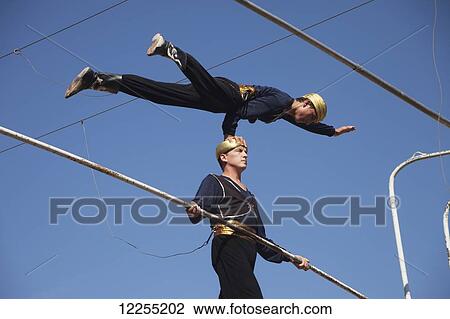 Trapeze artists, Ichan Kala Old City, Kizilkum desert; Khiva, Khwarezm region, Uzbekistan View Large Photo Image Stock Image - Trapeze artists, Ichan Kala Old City, Kizilkum desert; Khiva, Khwarezm region, Uzbekistan. Fotosearch