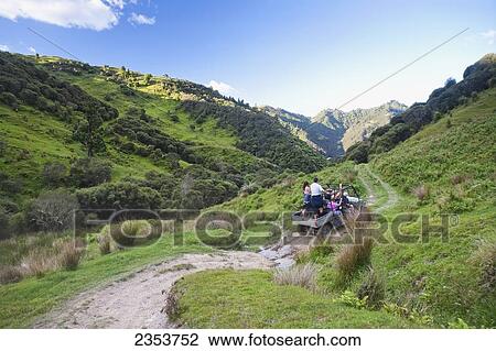 Travelers Explore The Grounds Of The Blue Duck Lodge On A Buggy Tour, Whanganui National Park; Whakahoro, New Zealand View Large Photo Image Stock Image - Travelers Explore The Grounds Of The Blue Duck Lodge On A Buggy Tour, Whanganui National Park; Whakahoro, New Zealand. Fotosearch